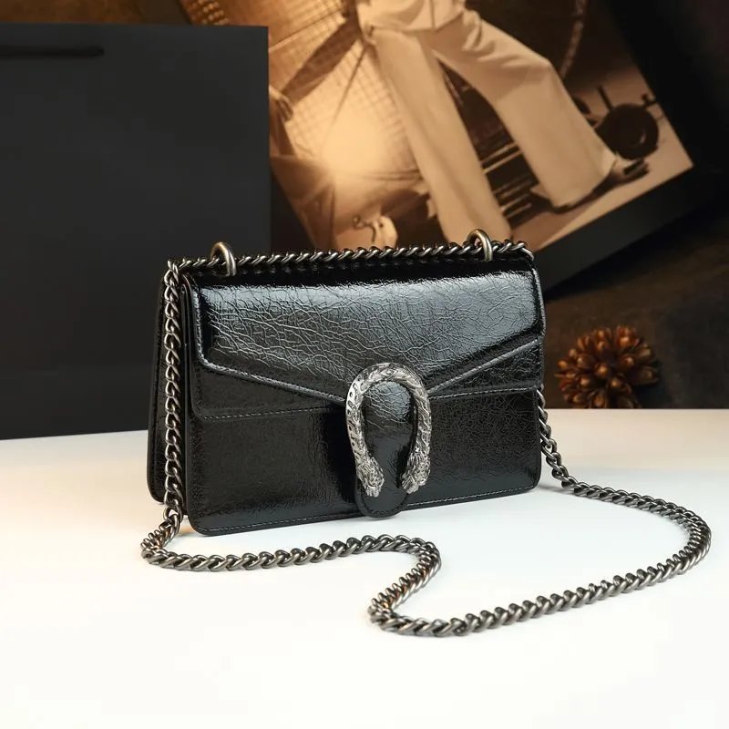 Unbranded Crossbody Bags Flap bag with chain strap and textured U-shaped clasp — Black