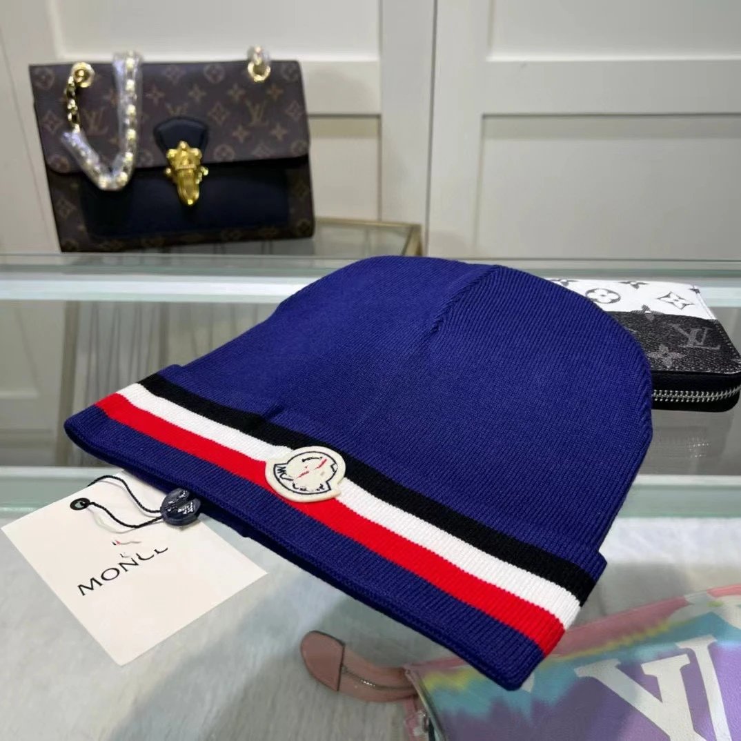 Moncler Hats Knitted beanie with tricolor stripe and logo patch — Blue