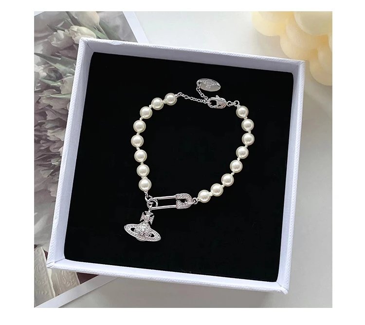 Unbranded Jewelry Orb and Cross Pendant Necklace — Pearl brooch bracelet (silver)