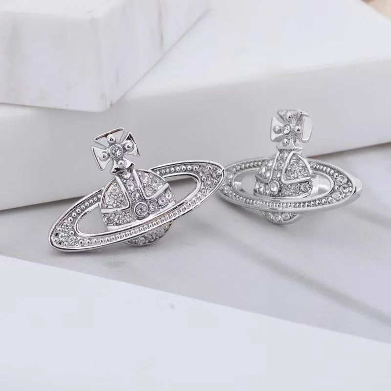Unbranded Jewelry Orb and Cross Pendant Necklace — Saturn stud earrings (silver)
