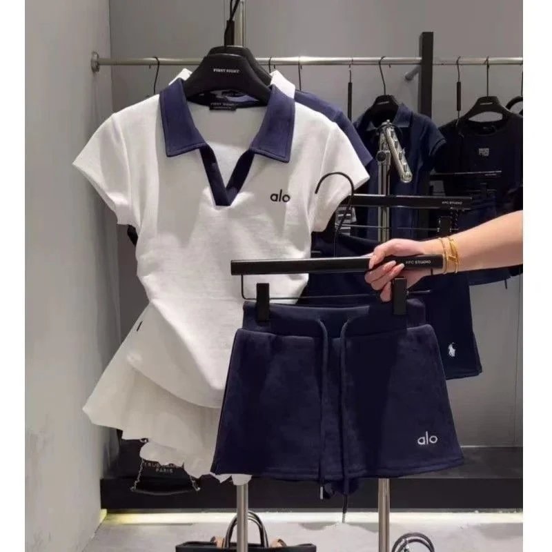 Alo Matching Sets Short-sleeve collared top and drawstring shorts set — White top with blue shorts