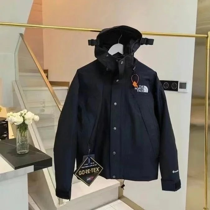 Nike Jackets Hooded color-block windbreaker jacket — TNF-Black