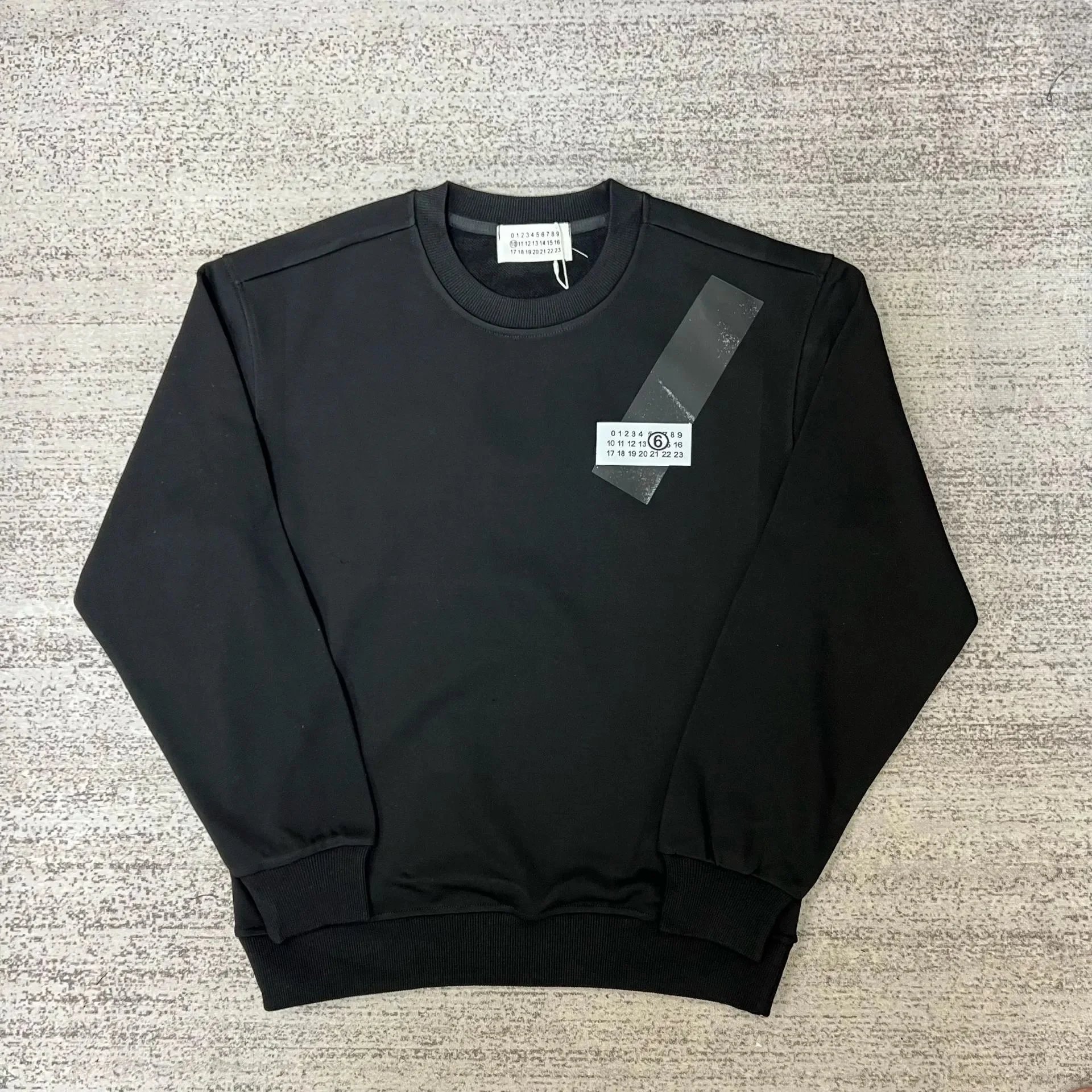 Maison Margiela Graphic crewneck sweatshirts and rib-knit sweaters — 24 black