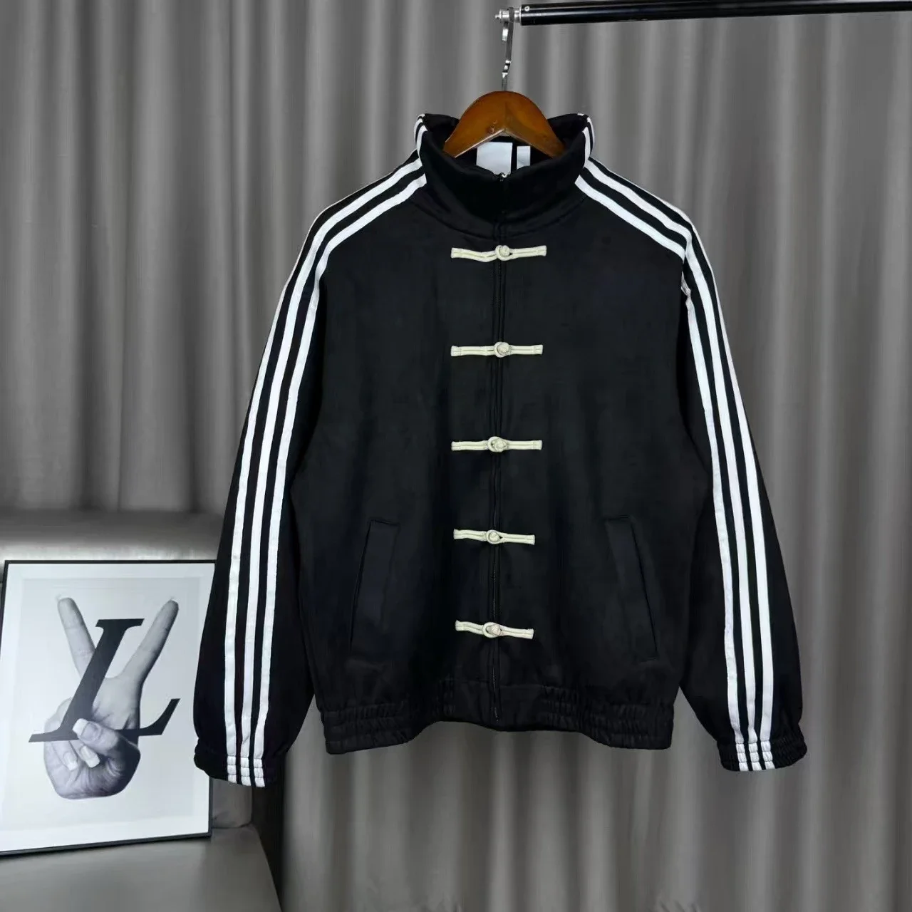 Adidas Originals' Year of the Snake limited edition new Chinese-style Tang suit jacket with frog buttons.
