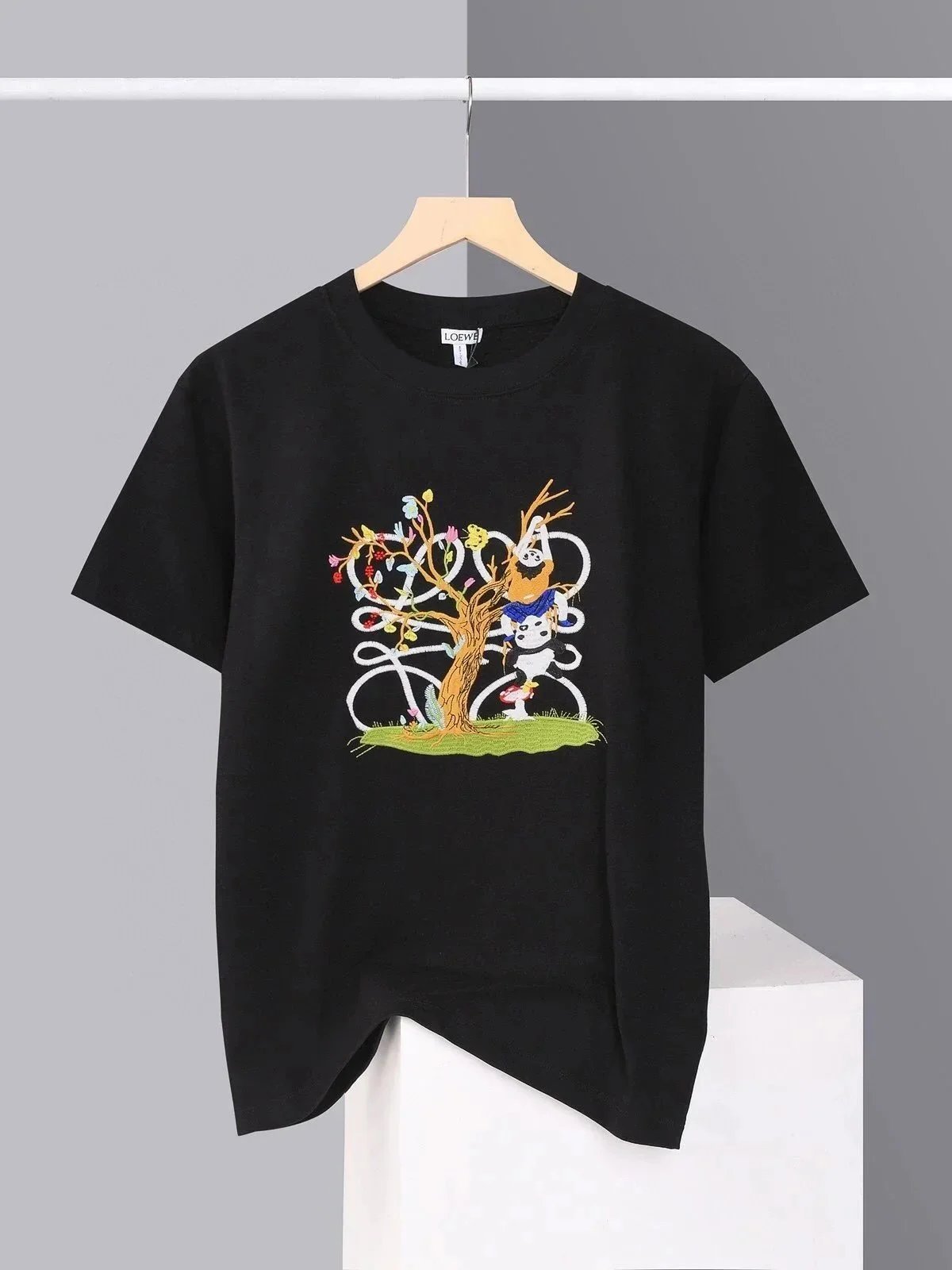 Loewe black short sleeve t-shirt with panda and tree graphic