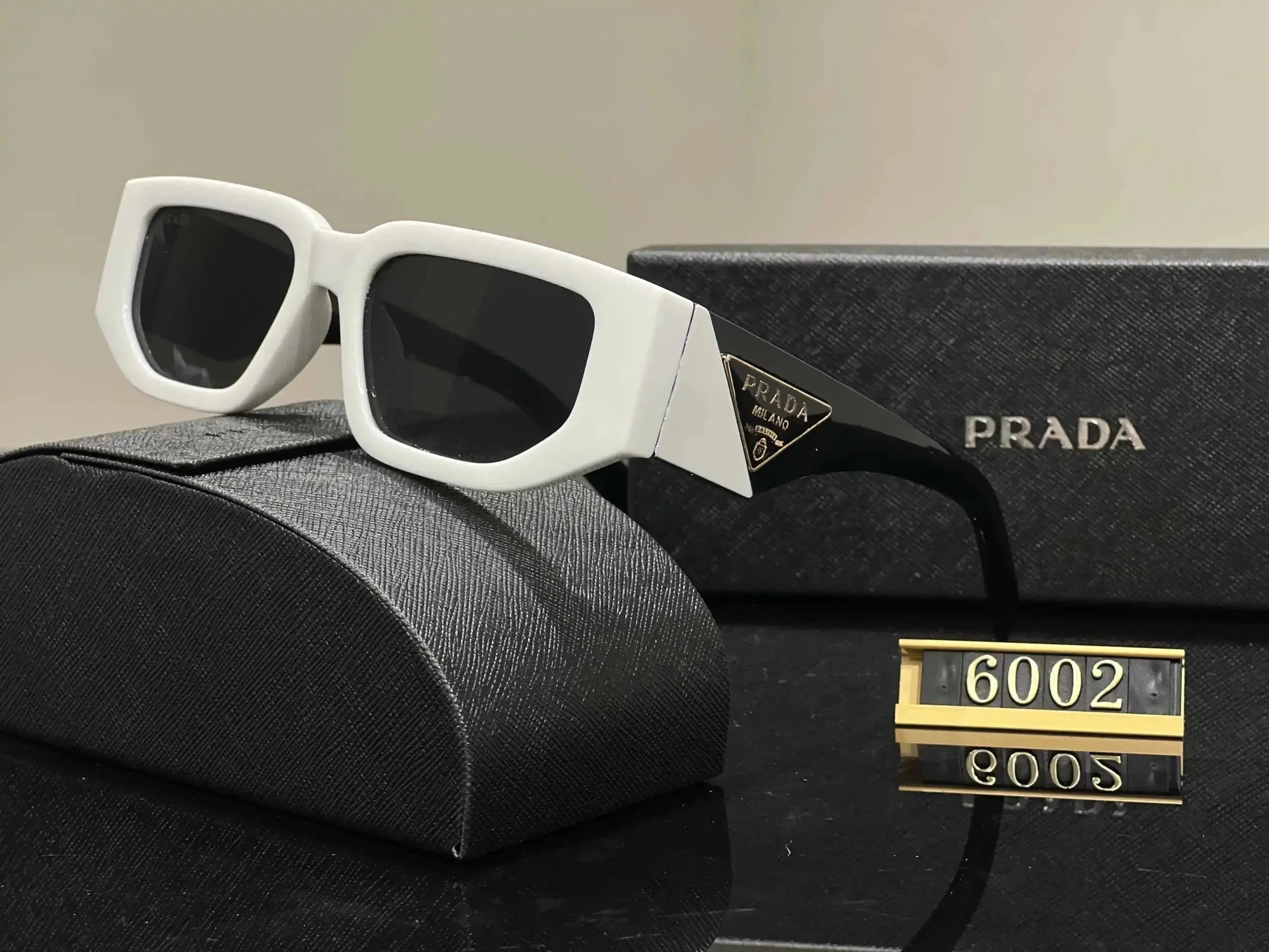 Prada Eyewear Sunglasses — 37