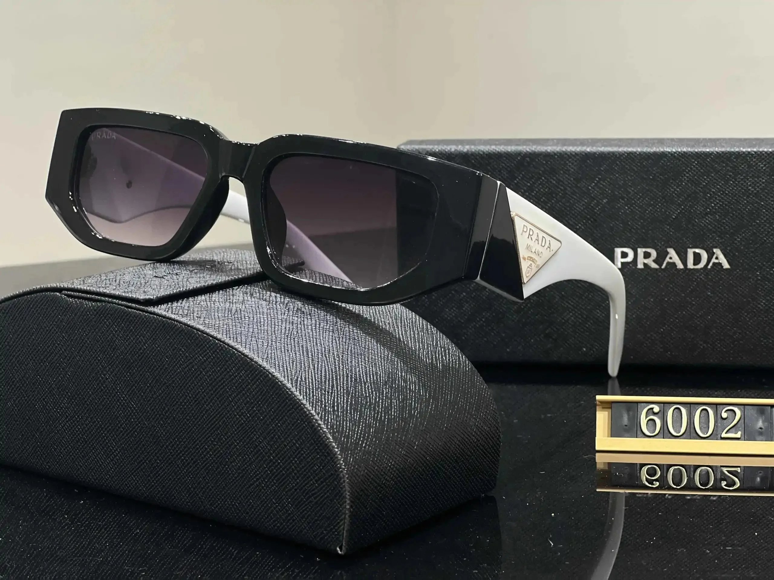 Prada Eyewear Sunglasses — 40