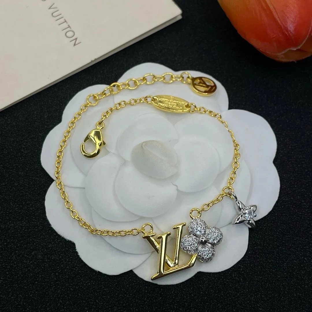 Louis Vuitton Gold-Tone LV and Flower Charm Bracelet - Jewelry Spreadsheet, Jewelry List, Accessory Picks