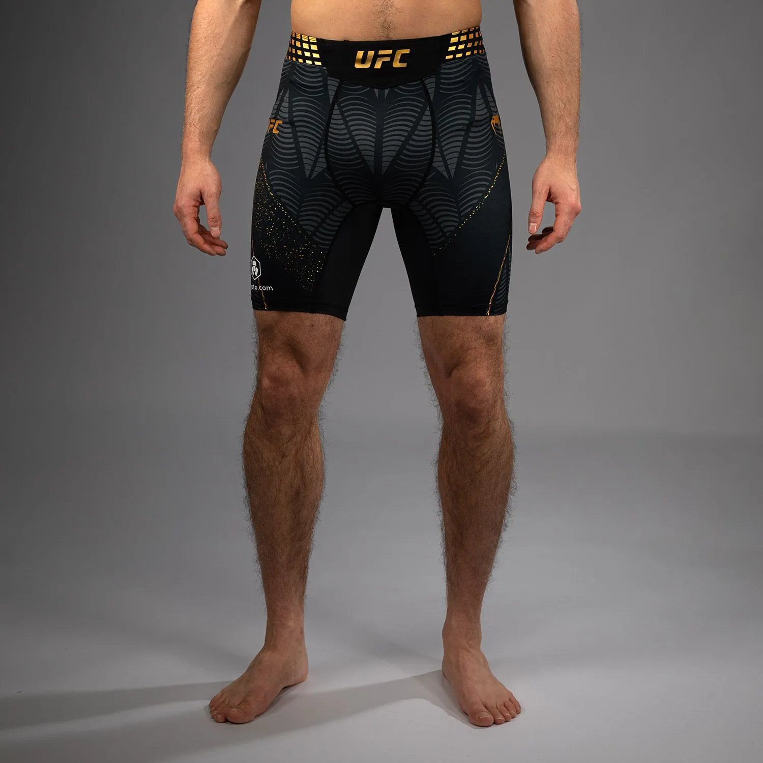 Venum T-Shirts Short-Sleeve UFC Fight Shirt — 10-Black and gold tight shorts