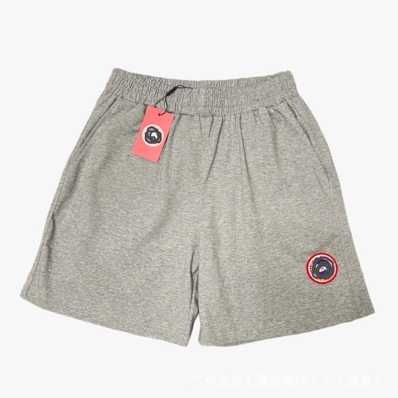 Gray pants with a red label