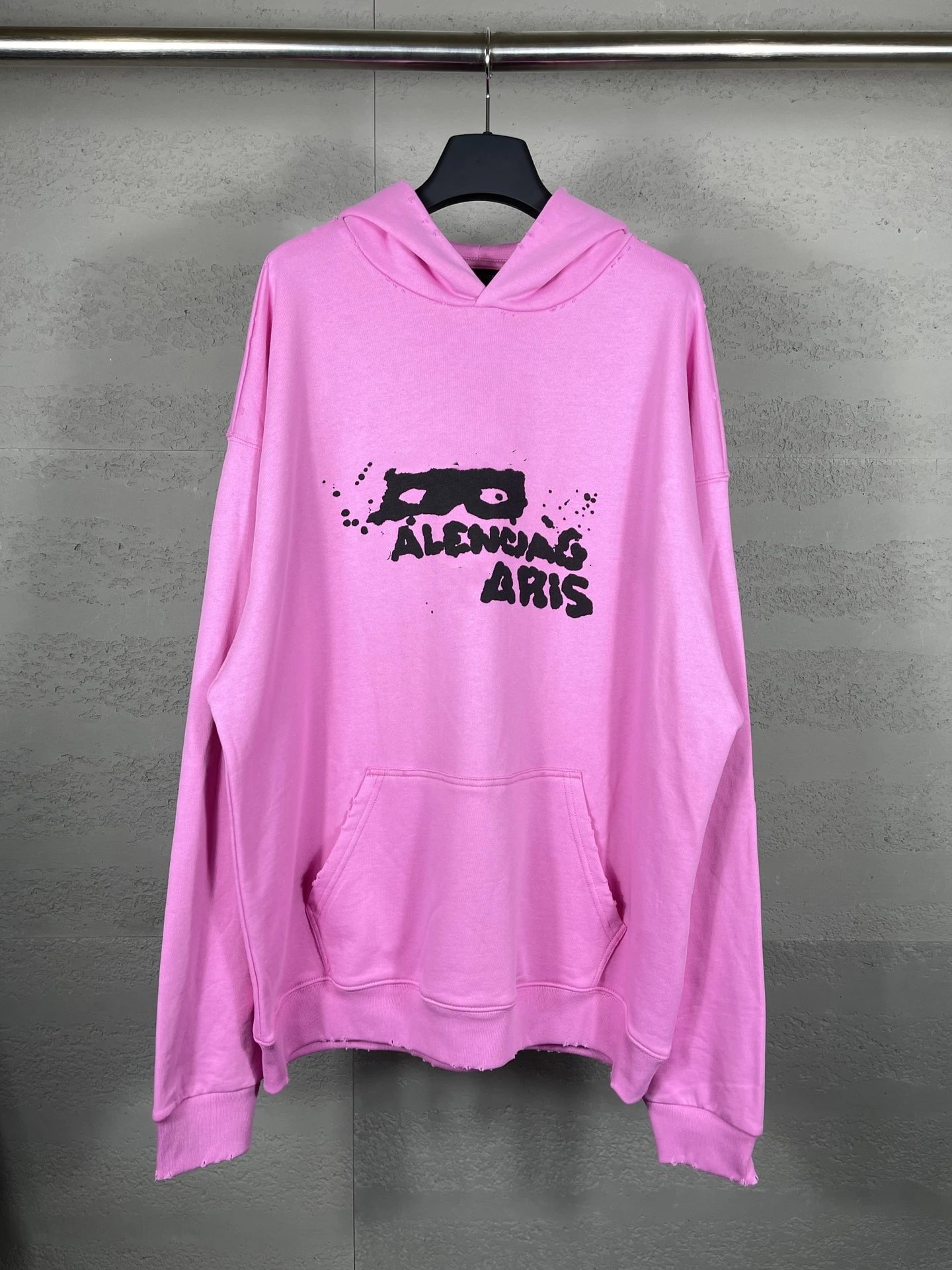 Balenciaga Distressed Pink Hoodie with Graphic Print