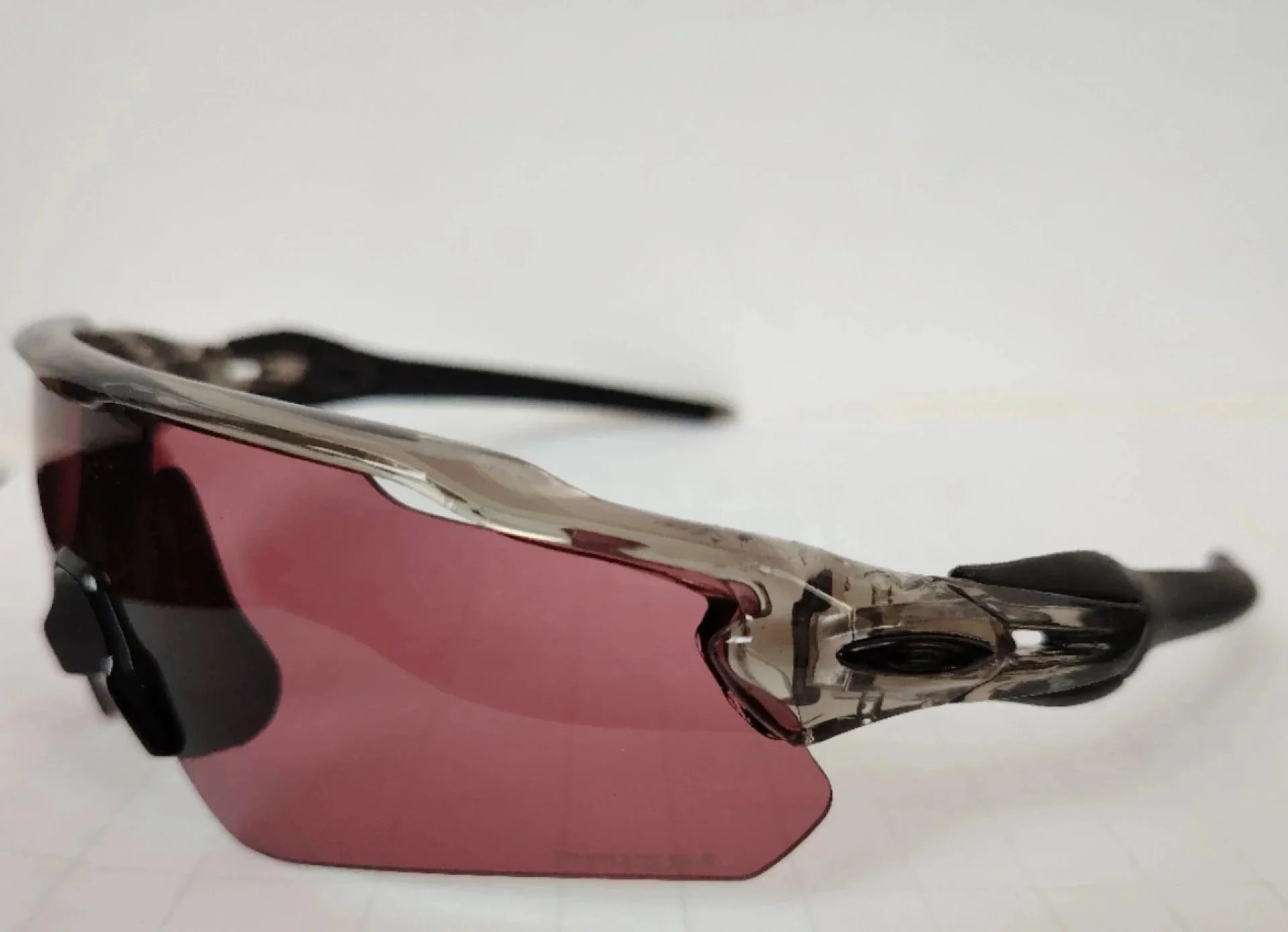 Unbranded Eyewear Wraparound shield sports sunglasses — Transparent gray frame, black label, black foot cover, purple lens