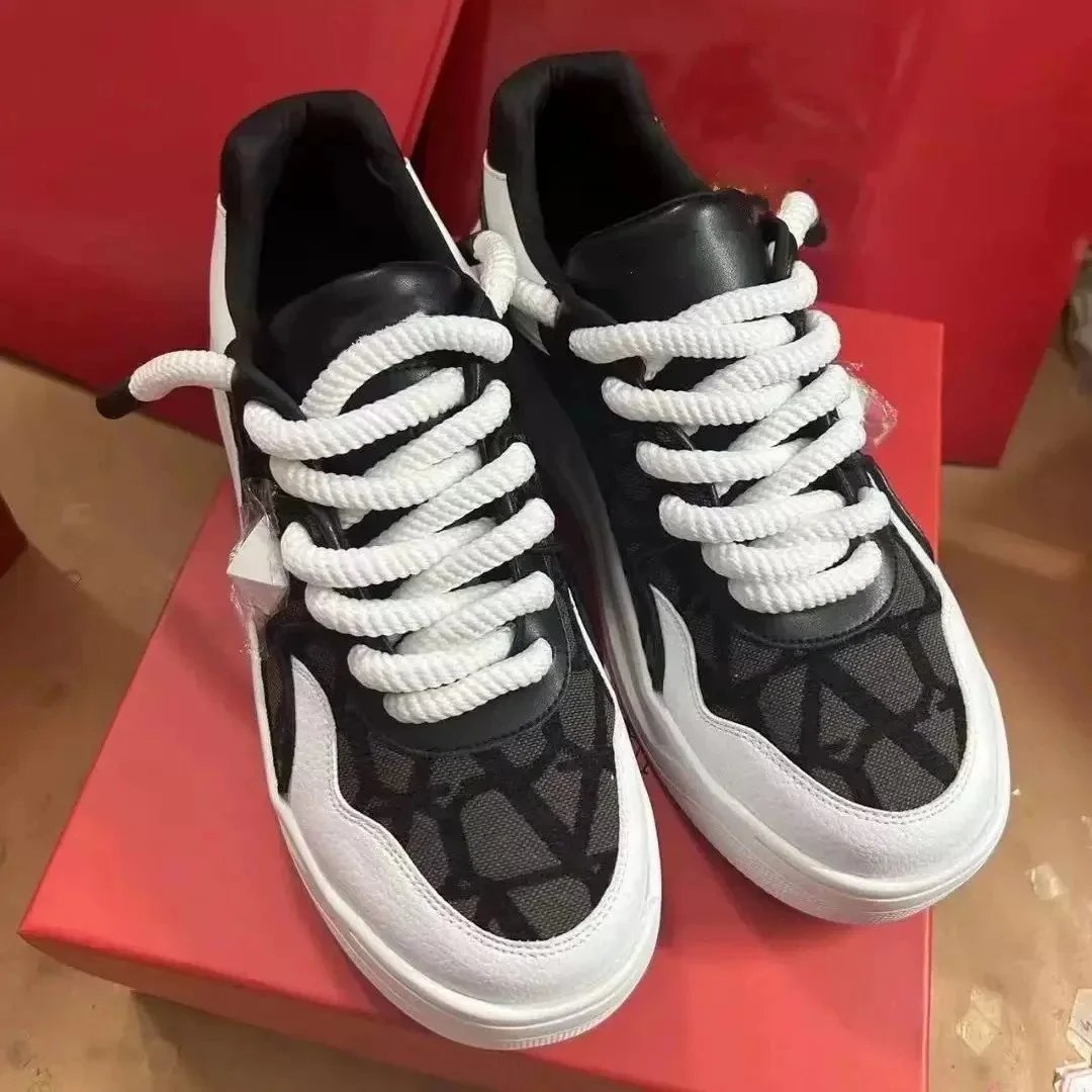 Valentino Garavani Sneakers Low-top platform with pyramid stud detail — Black, white, and brown