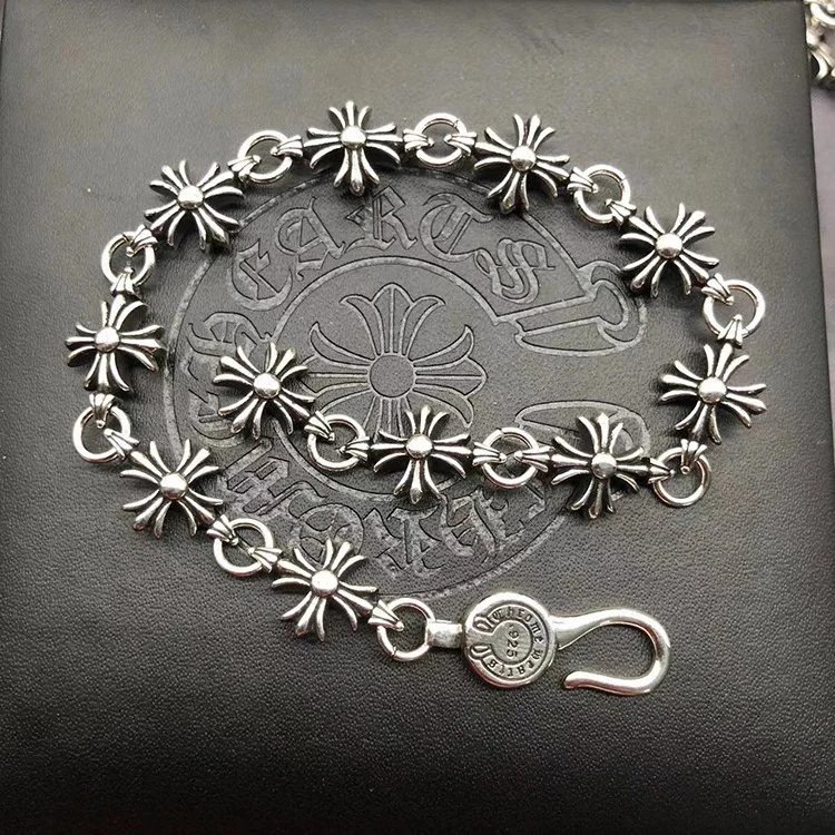 Unbranded Jewelry Floral cross link bracelet — Small trumpet-shaped cross bracelet