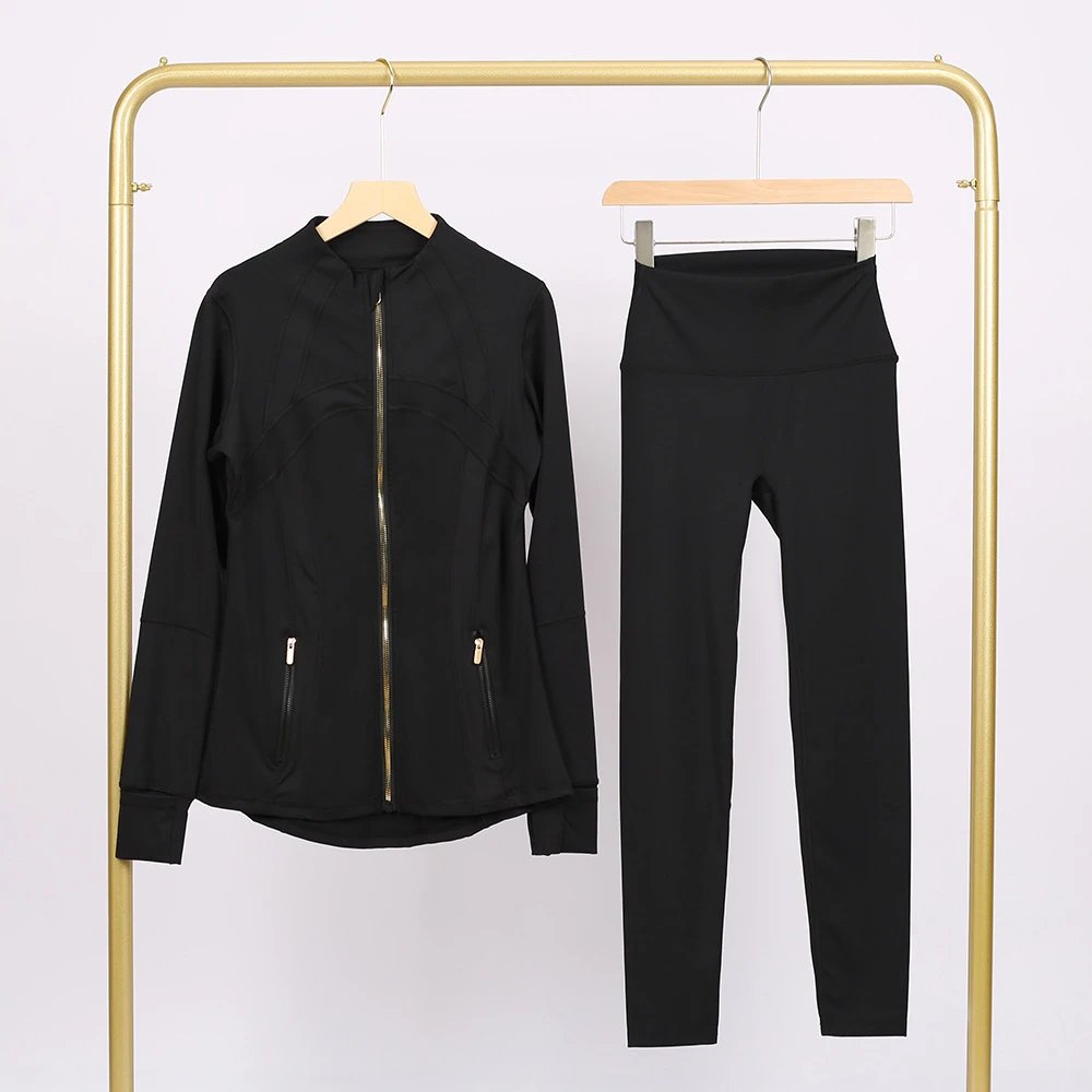 Alo Matching Sets Contrast-Trim Crop Top and Wrap-Style Skirt Set — Black jacket with gold zipper and cropped pants set