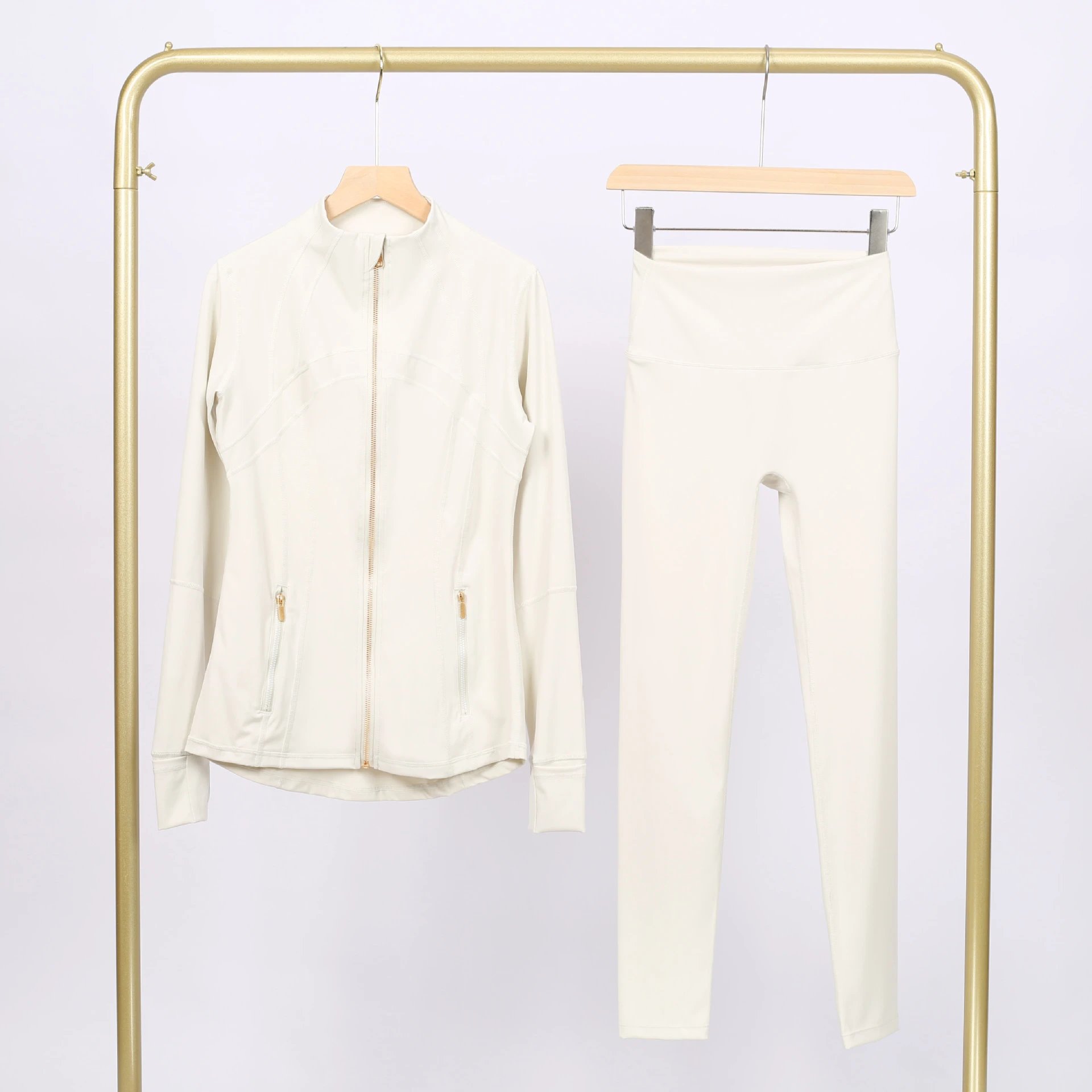 Alo Matching Sets Contrast-Trim Crop Top and Wrap-Style Skirt Set — Albumin gold-zip jacket and cropped pants set