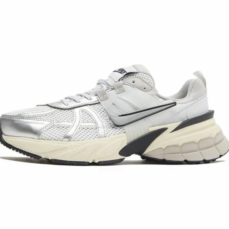 Nike White mesh upper with silver metallic toe cap, black swoosh overlay, cream midsole, black outsole