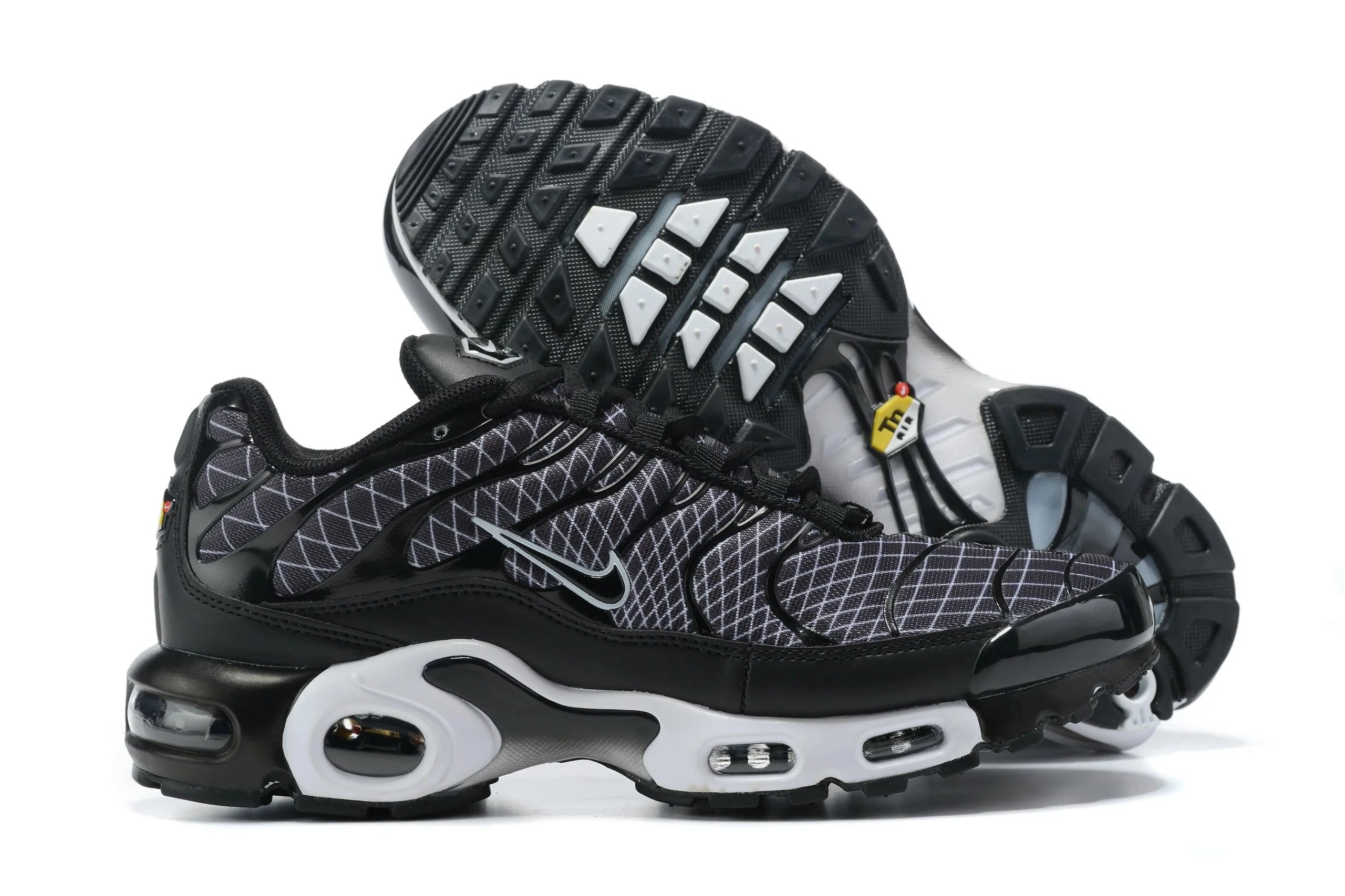 Nike Air Max Plus Black/White Grid Pattern Sneakers