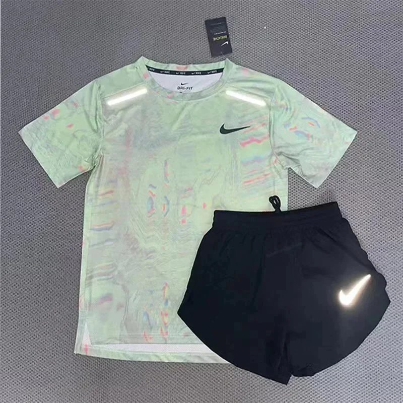 Nike Matching Sets Patterned running top and reflective shorts set — Light green short-sleeve and three-quarter-length shorts set
