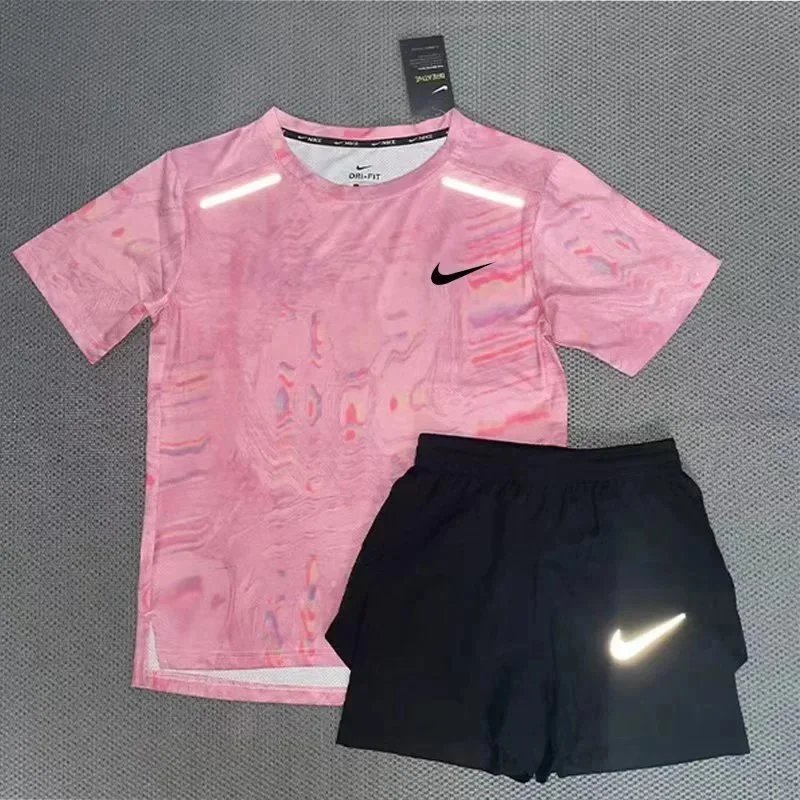 Nike Matching Sets Patterned running top and reflective shorts set — Pink short-sleeved top and 3/4-length shorts set