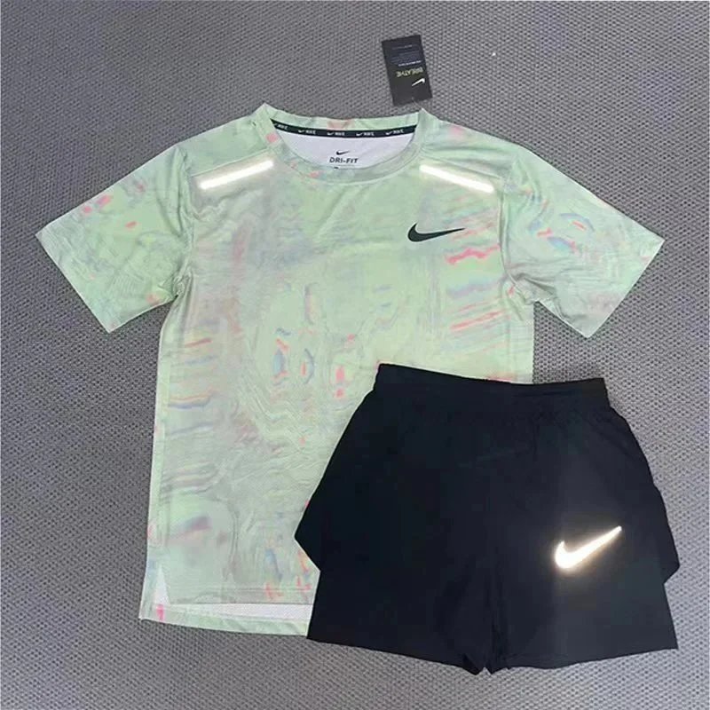 Nike Matching Sets Patterned running top and reflective shorts set — Light green short-sleeve top and three-quarter-length shorts set
