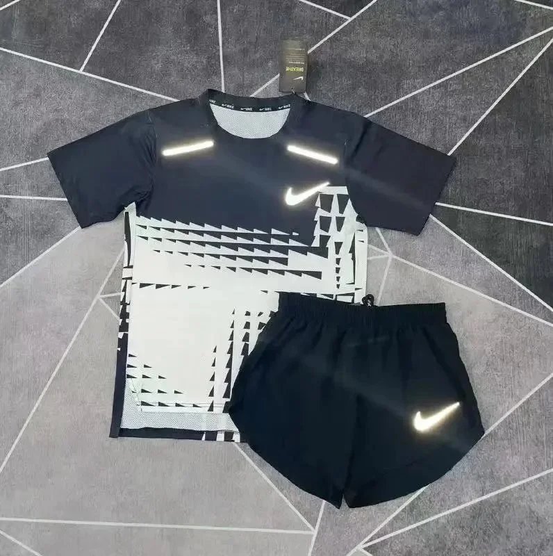 Nike Matching Sets Patterned running top and reflective shorts set — DA black and white short-sleeve T-shirt and 3/4-length shorts set