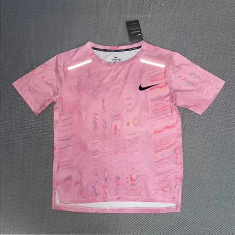 Nike Matching Sets Patterned running top and reflective shorts set — Pink short-sleeved shirt