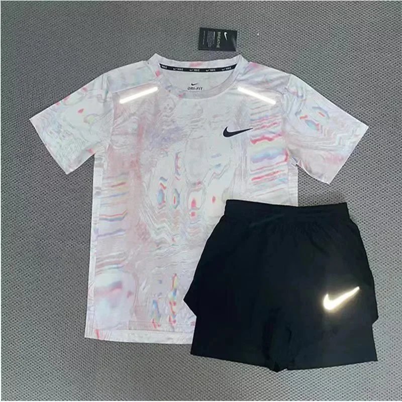 Nike Matching Sets Patterned running top and reflective shorts set — White powder short-sleeve top and three-quarter-length shorts set