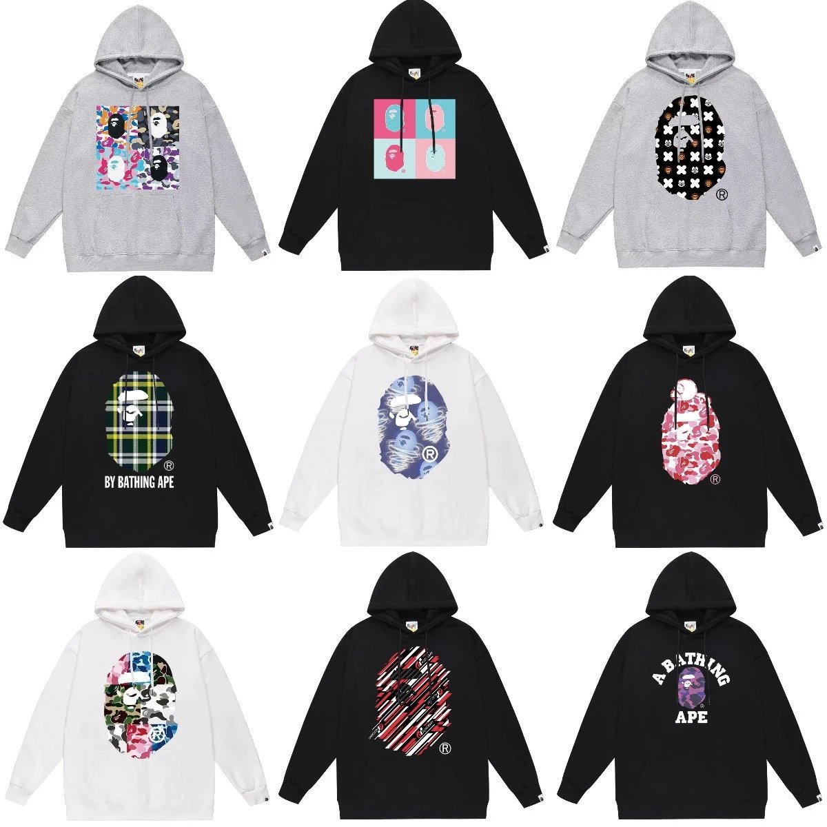 A BATHING APE Oversized hooded sweatshirt with large ape head graphic print, various patterns including camouflage, plaid, stripes, and pop-art squares