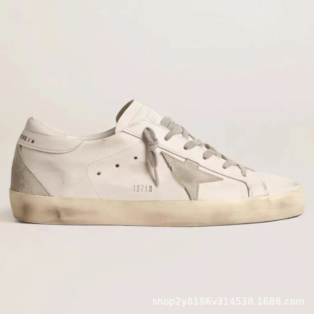 White heel with embossed letter