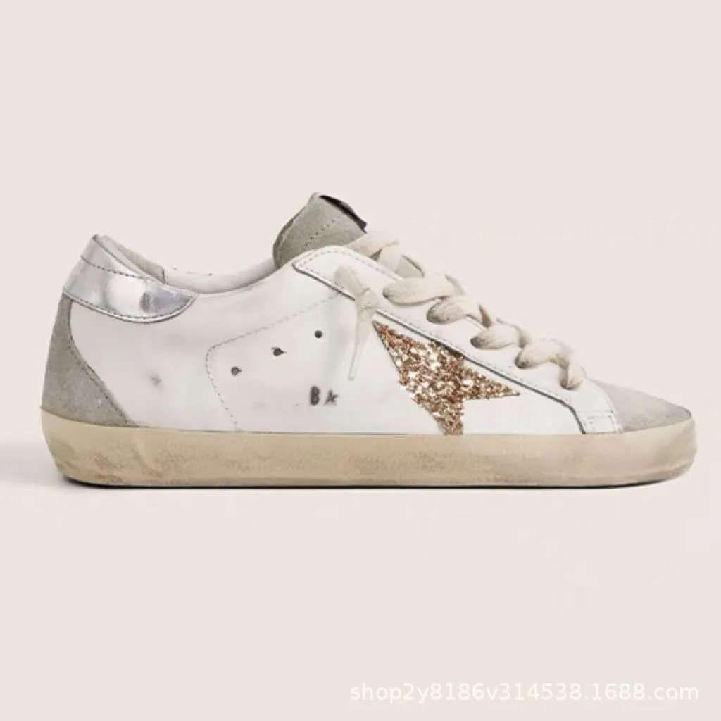 Silver heel with gold check star