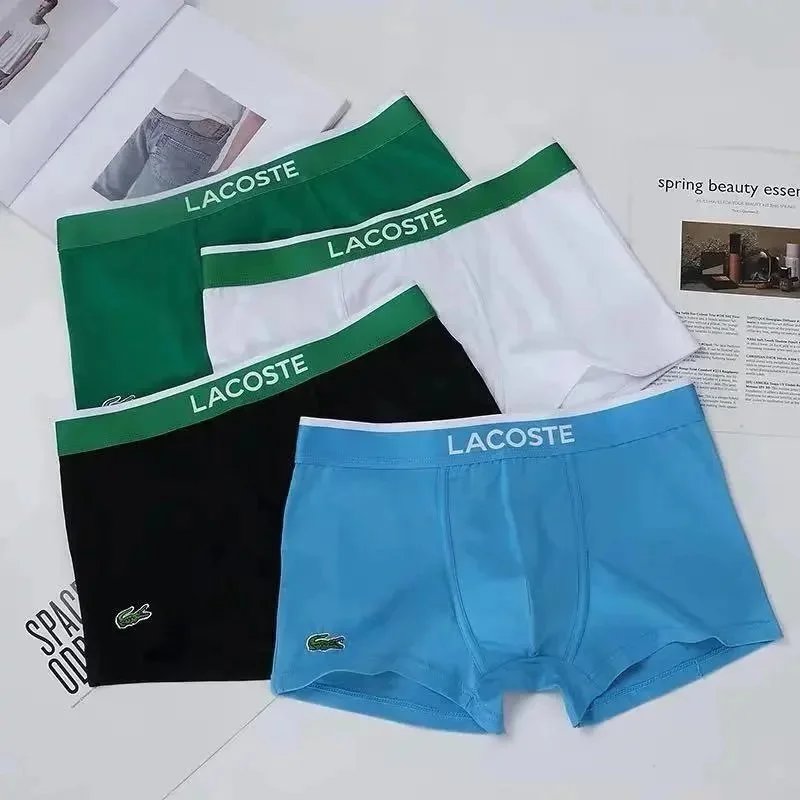 Lacoste Underwear Men's Boxer Briefs — A gift box containing four pieces in black, white, green, and blue.