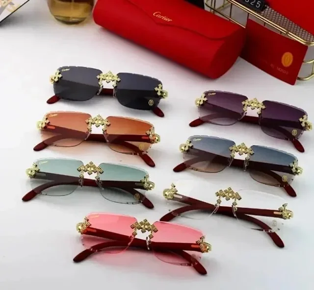 Cartier Eyewear Rimless Rectangular Sunglasses with Gold Cross Decorations product detail image 1