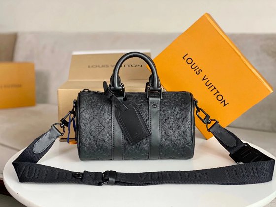 Keepall XS Bag M20900 Black Embossed Pillow Bag for Men - Introducing the new Aerogram version of the Keepall XS, crafted from soft black grained leather for an understated and stylish look. Features a black embossed logo, leather body with top handles and an adjustable shoulder strap...
