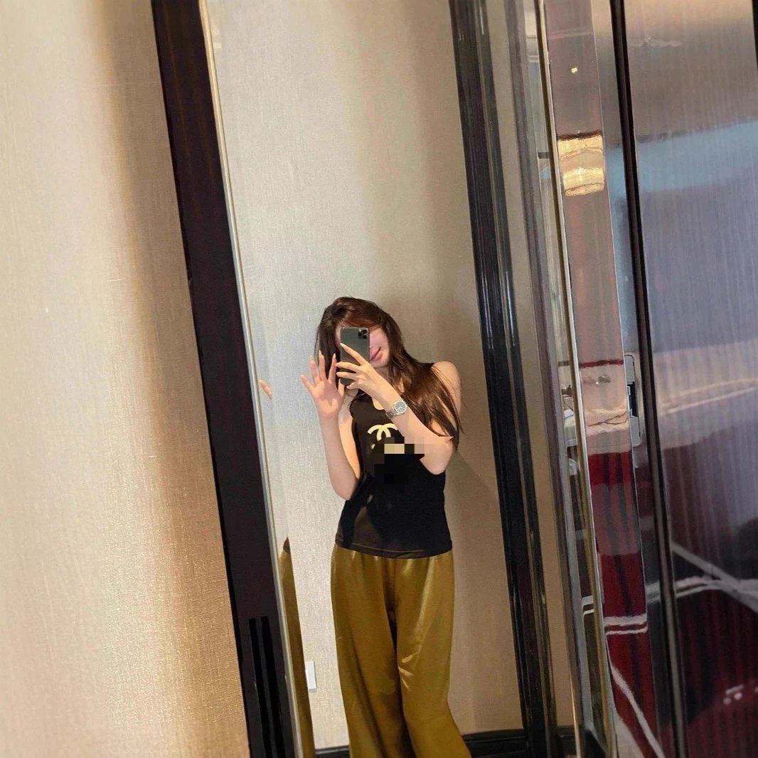Black Sleeveless Top Gold Satin Pants Casual Outfit