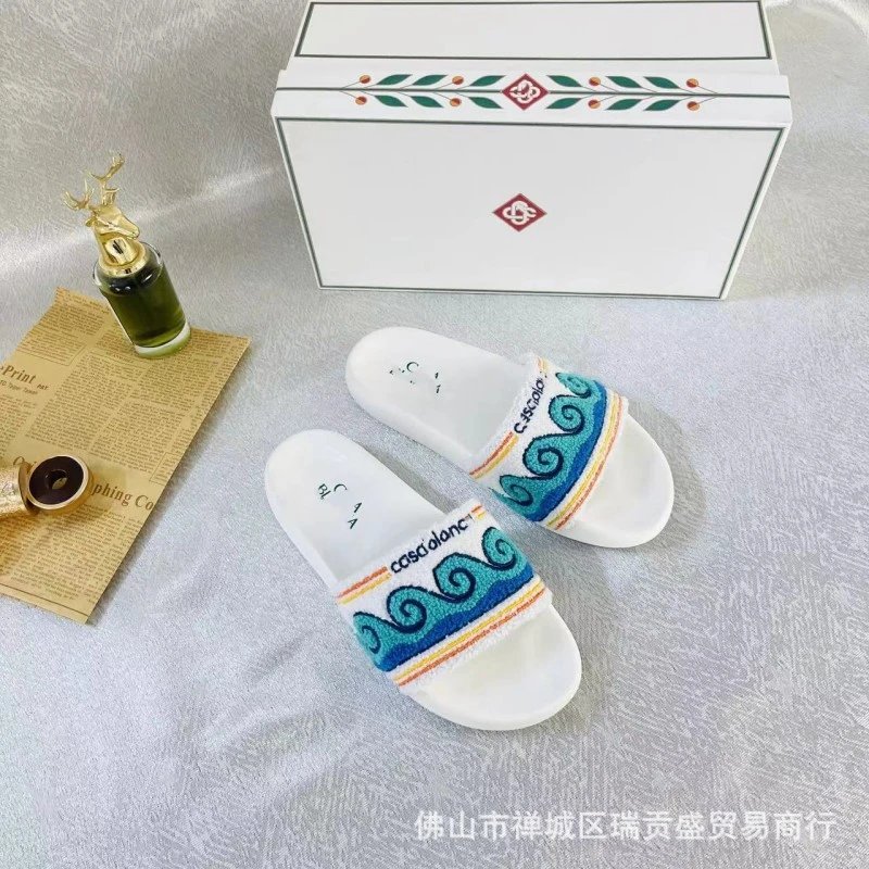 C&A Slippers Embroidered slide — Wave pattern