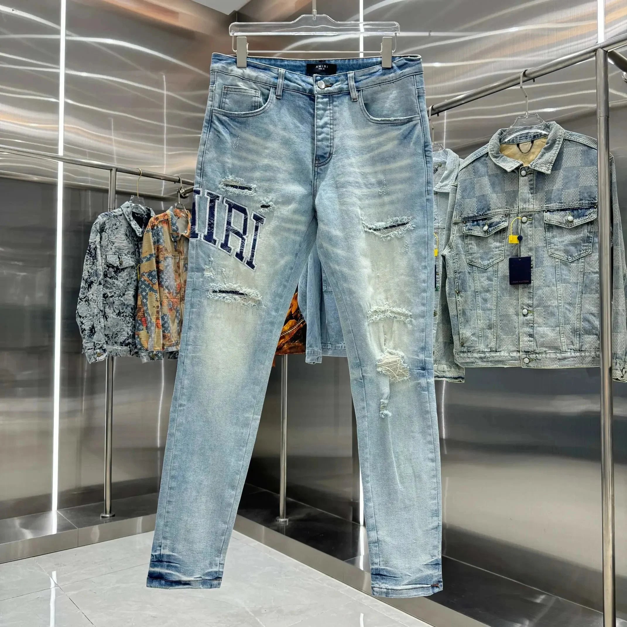 AMIRI distressed logo jeans.