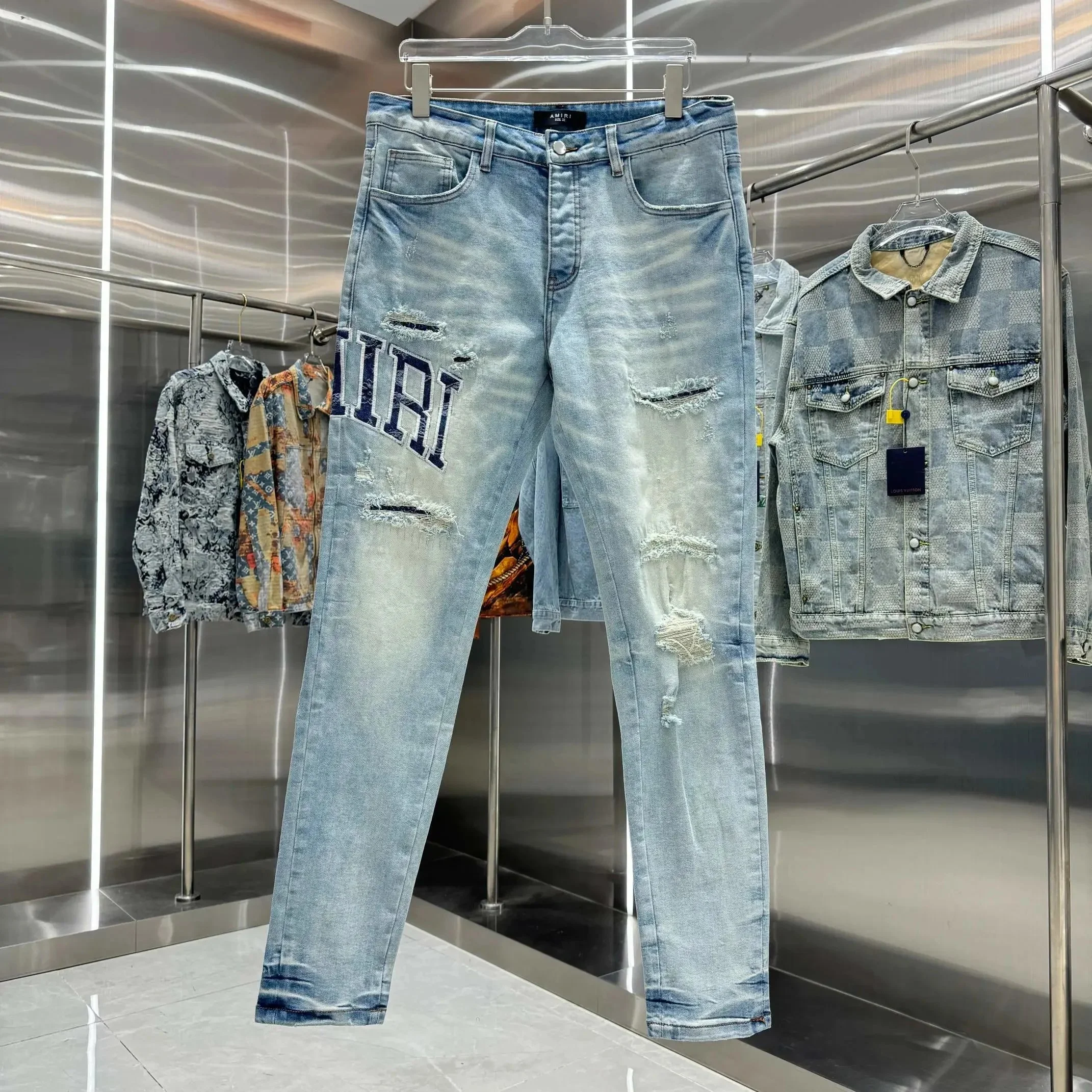 Amiri — Washed Blue Slim-Fit Tapered Jeans with Letter Patches and Distressing