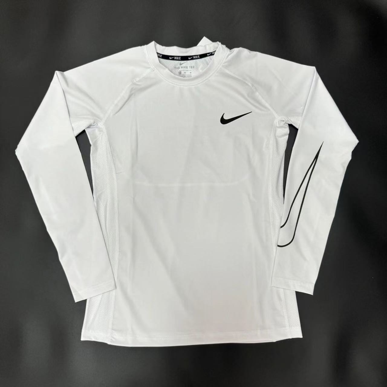 Nike, Category: Quick-drying, tight-fitting long-sleeved athletic training T-shirts - zdjęcie produktu (rep) w bazie UsFind
