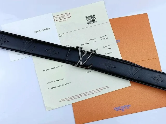 Louis Vuitton Belts Black textured belt with LV initial buckle product detail image 4