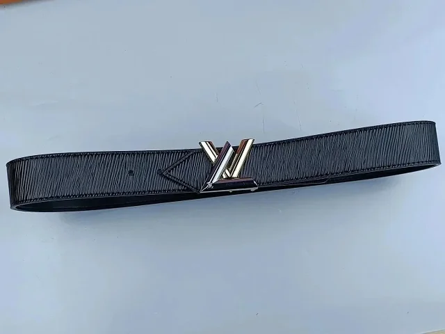 Louis Vuitton Belts Black textured belt with LV initial buckle product detail image 7