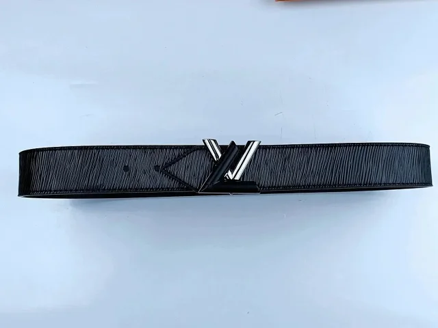 Louis Vuitton Belts Black textured belt with LV initial buckle product detail image 8