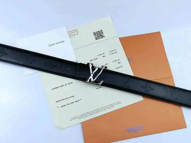 Louis Vuitton Belts Black textured belt with LV initial buckle product detail image 3