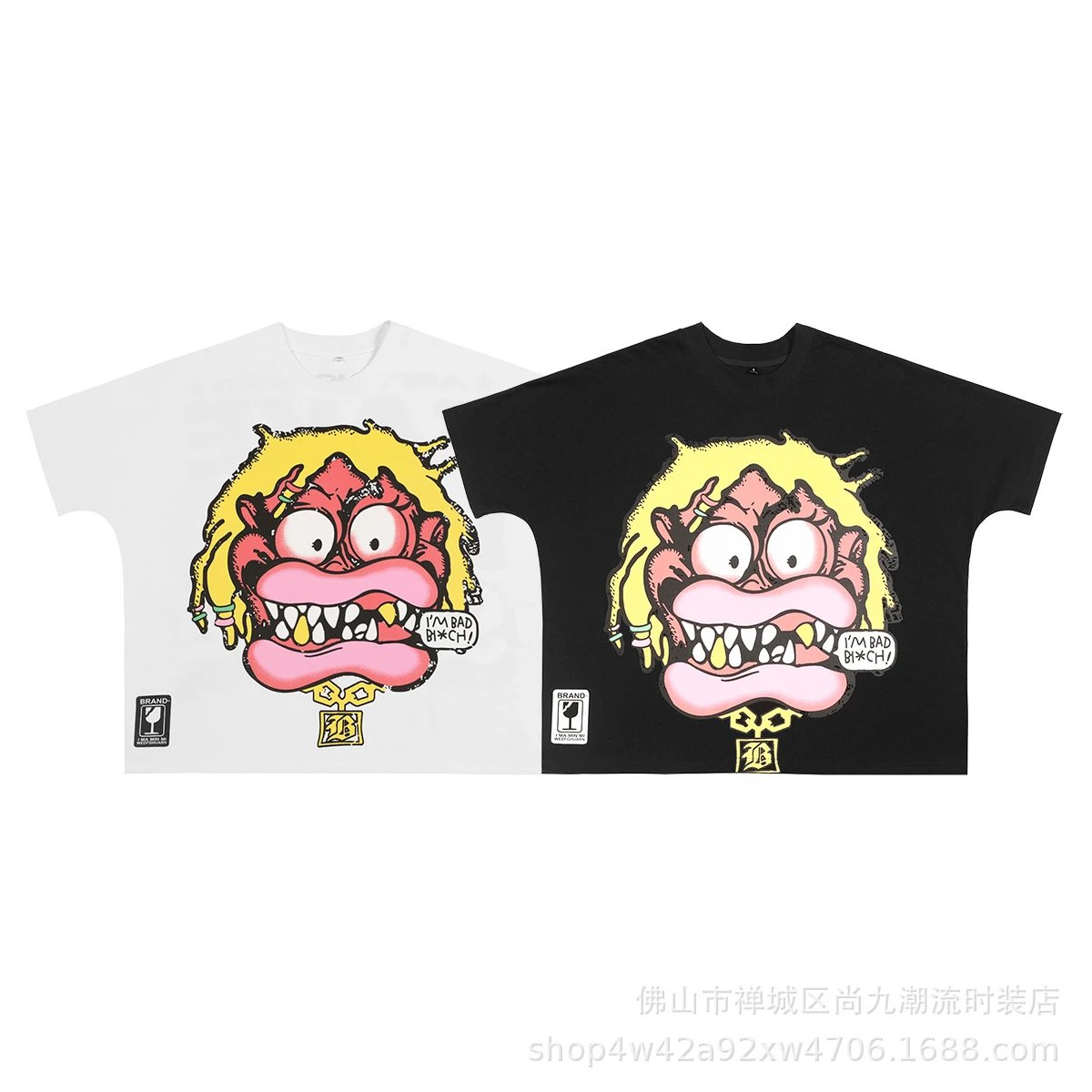 White and black oversized short sleeve T-shirts with cartoon monster face print, yellow hair, pink lips, sharp teeth, and 'I'M BAD B!#CH!' speech bubble
