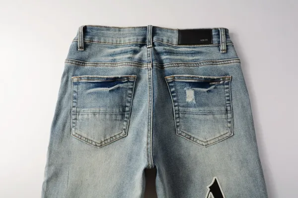 Amiri Distressed Logo Print Light Wash Skinny Jeans - 7