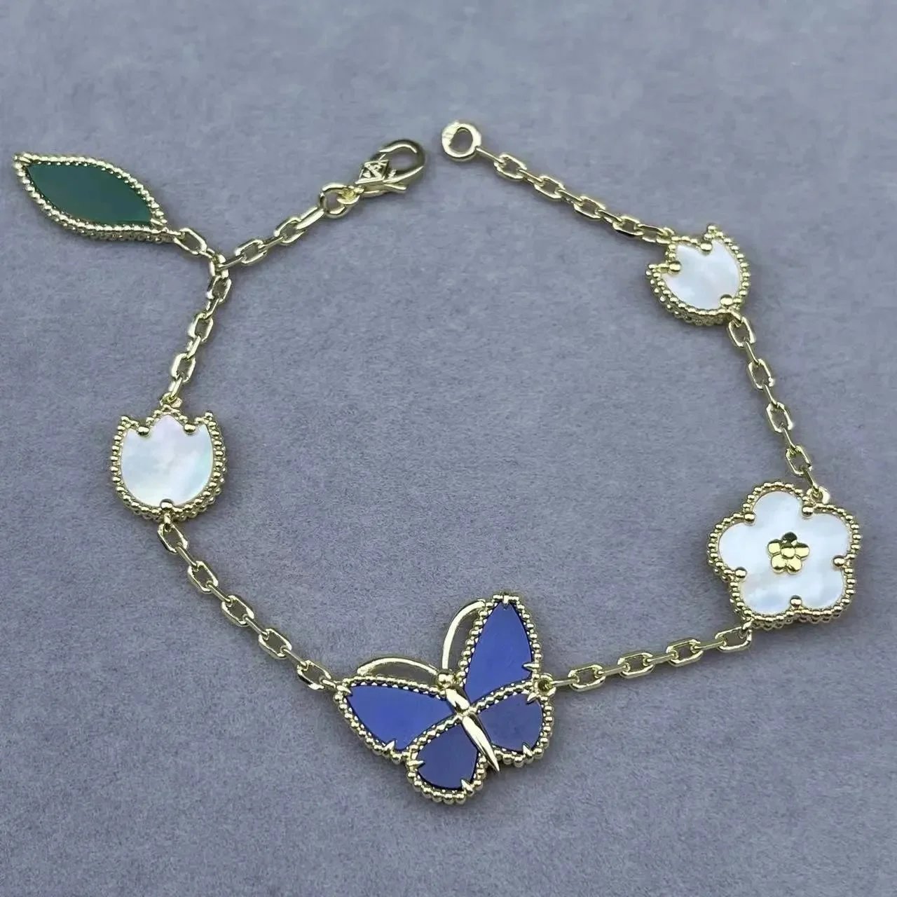 Unbranded Jewelry Floral Butterfly and Leaf Charm Necklace — Butterfly (blue) bracelet