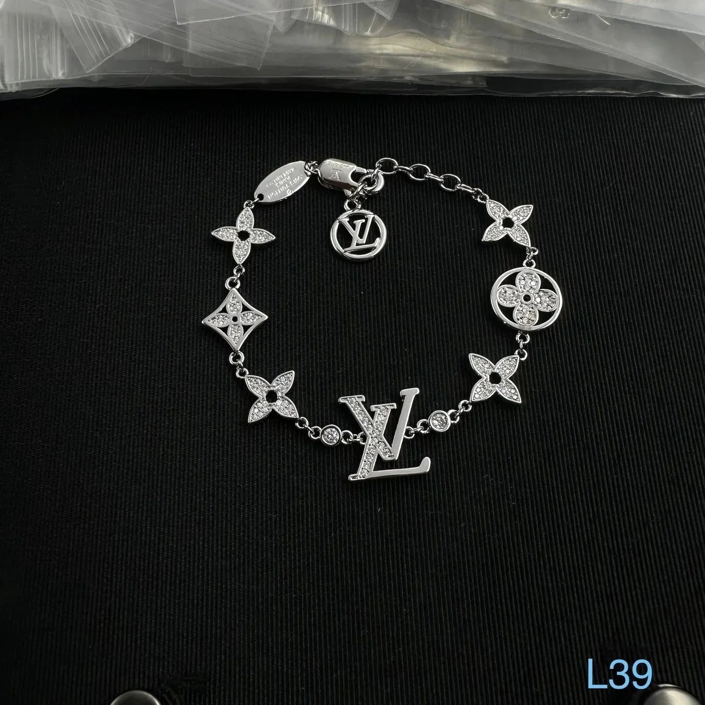 Unbranded Jewelry Floral Butterfly and Leaf Charm Necklace — Multi-flower silver (L) bracelet