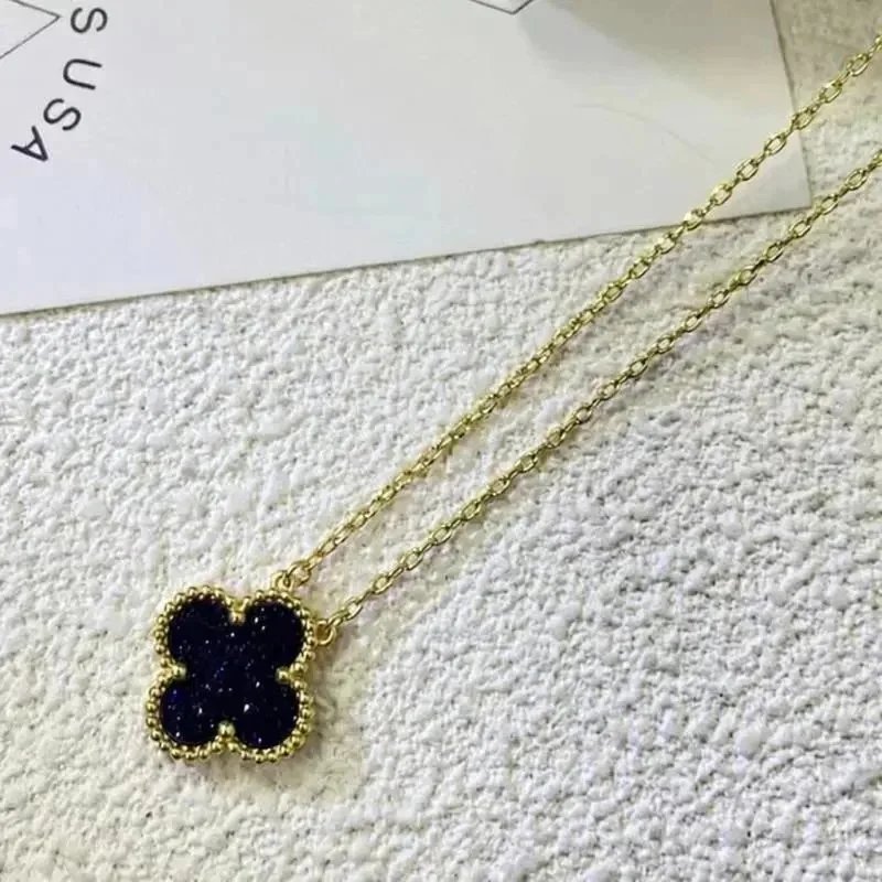 Unbranded Jewelry Floral Butterfly and Leaf Charm Necklace — Golden-colored [colored gemstone] necklace
