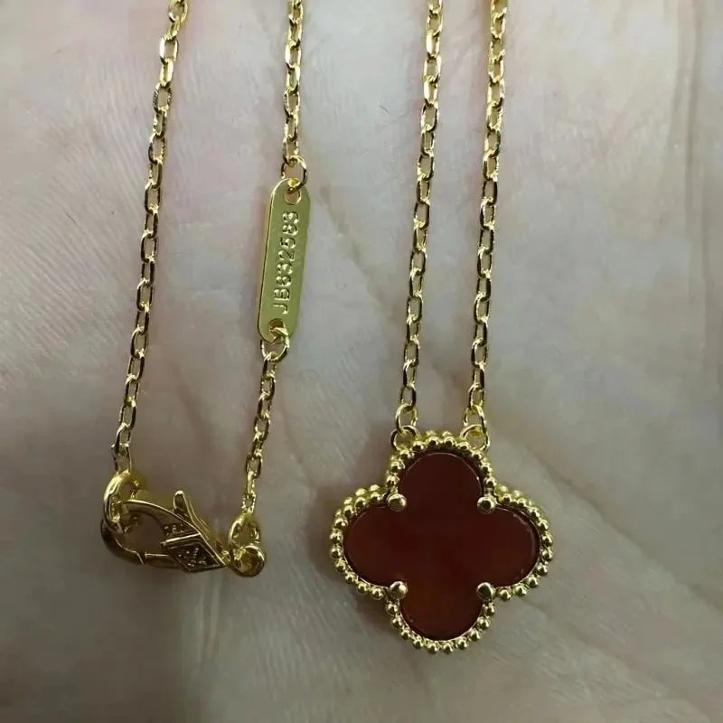 Unbranded Jewelry Floral Butterfly and Leaf Charm Necklace — Golden-colored [Red Agate] Necklace