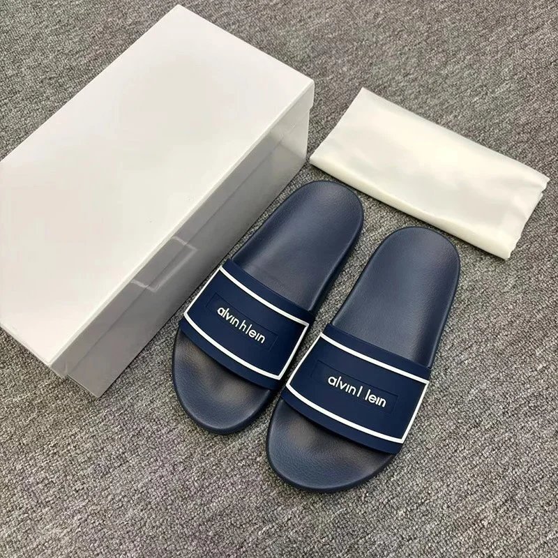 Calvin Klein Slippers Geometric cutout slide — CK-Blue and White Letters